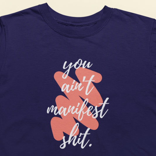 Navy blue t-shirt with white and coral text on a beige background