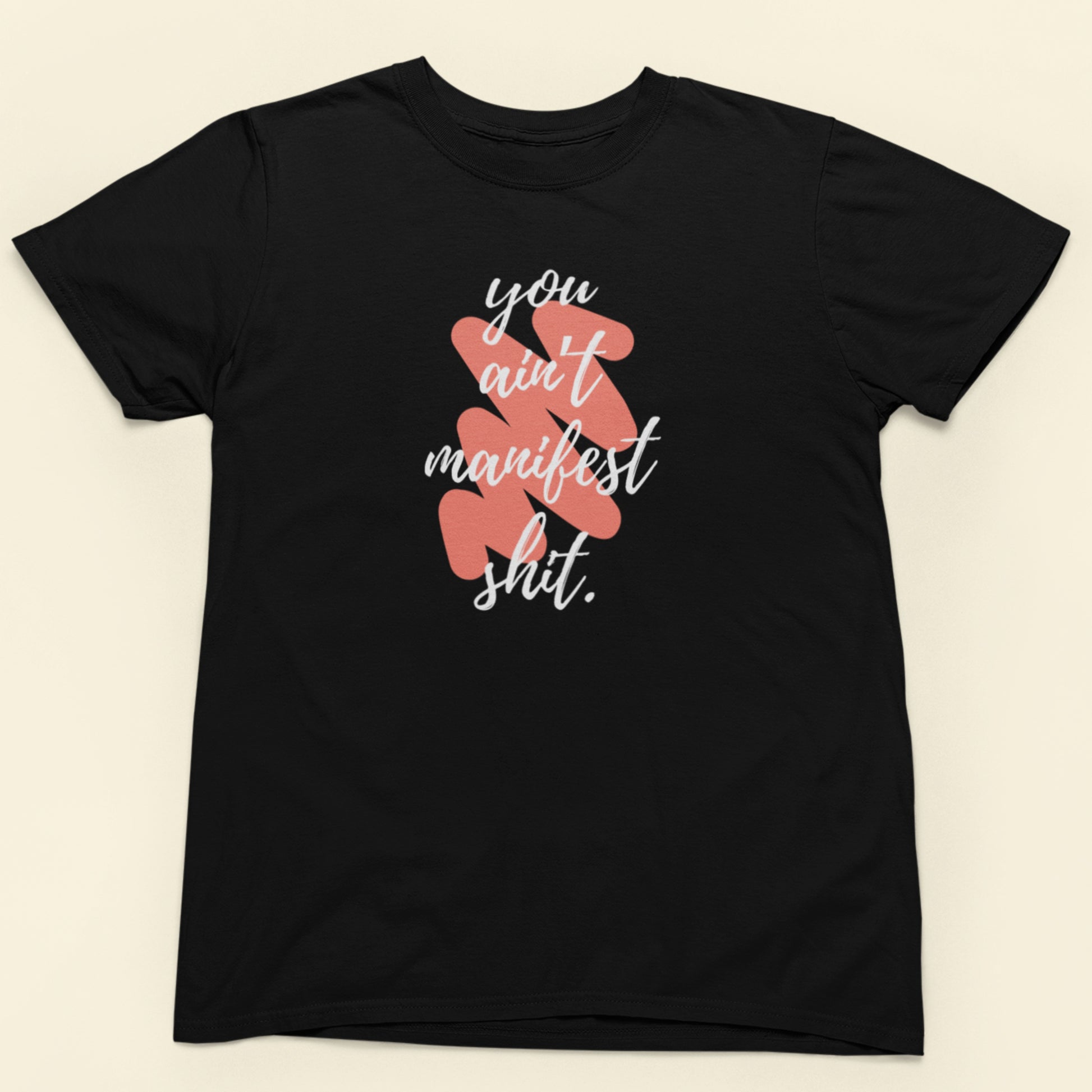 Black t-shirt with pink text and graphics on a beige background