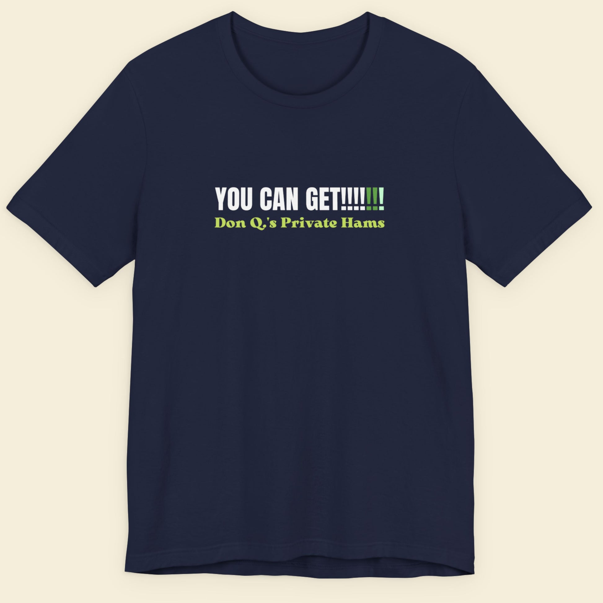 Navy blue t-shirt with humorous text design on a beige background.