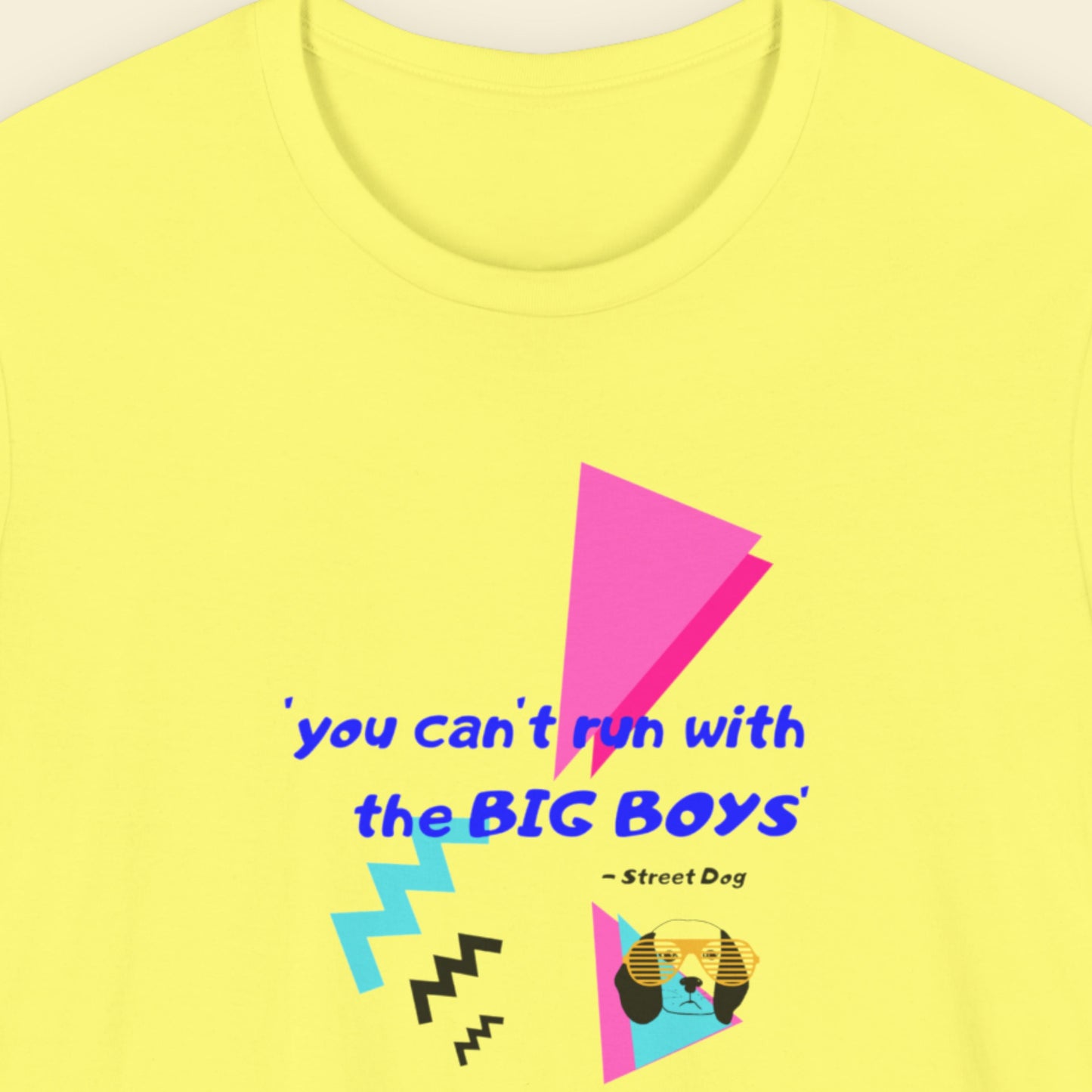 Yellow t-shirt with colorful text and graphics on a plain background.