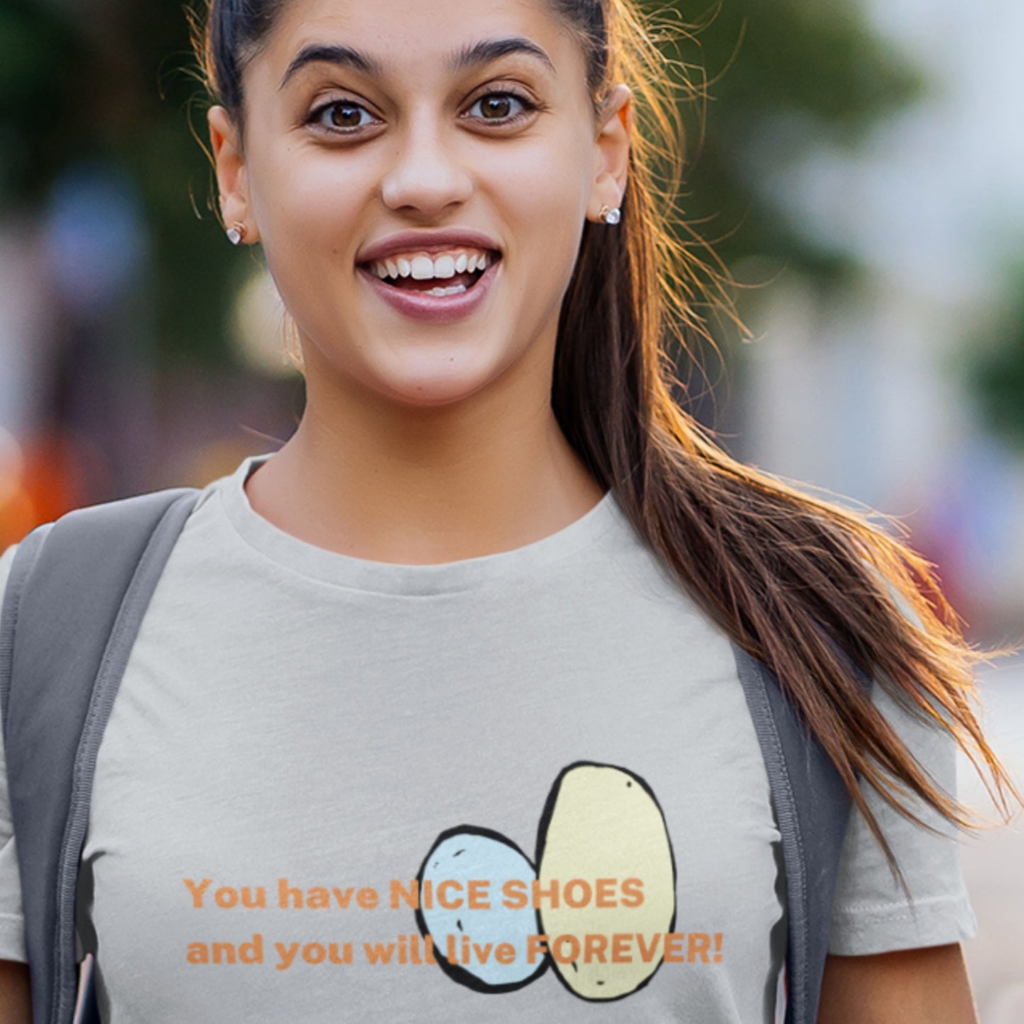 Woman wearing a t-shirt with humorous text and graphic design.