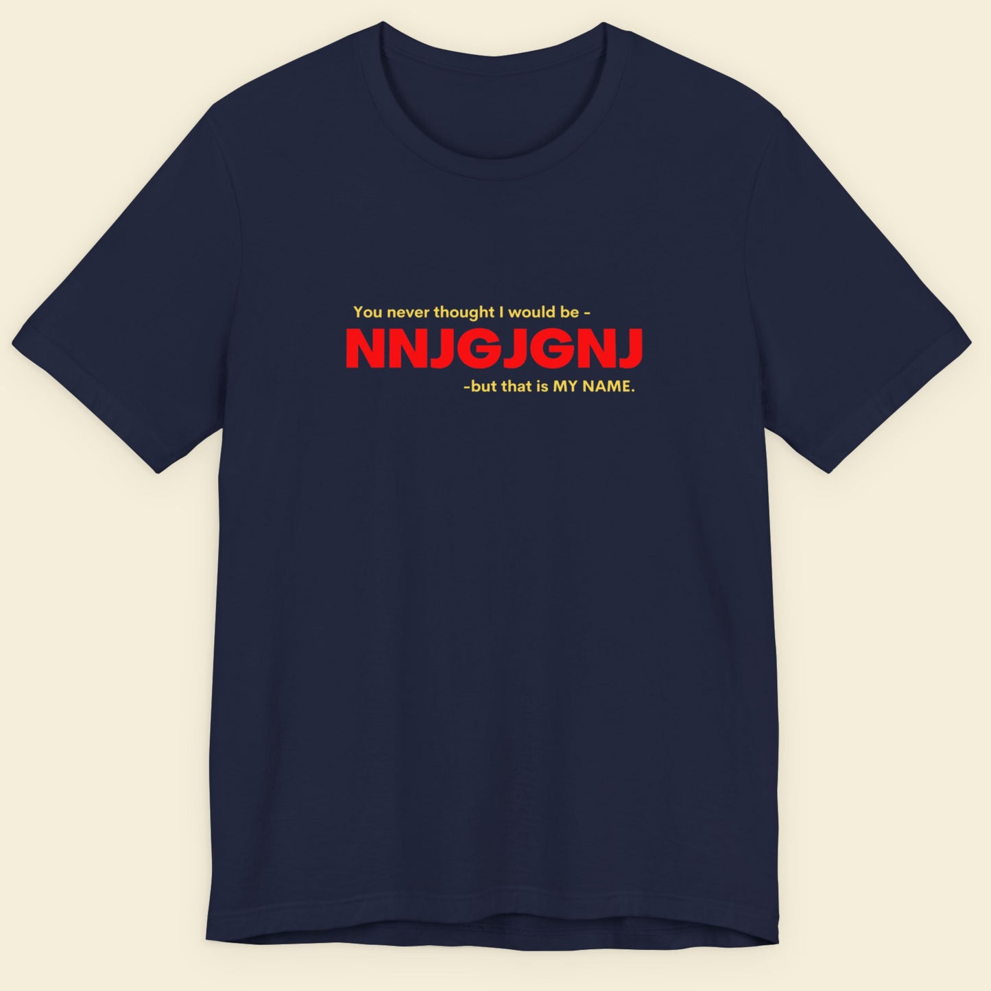 Navy blue t-shirt with red and white text on a beige background.