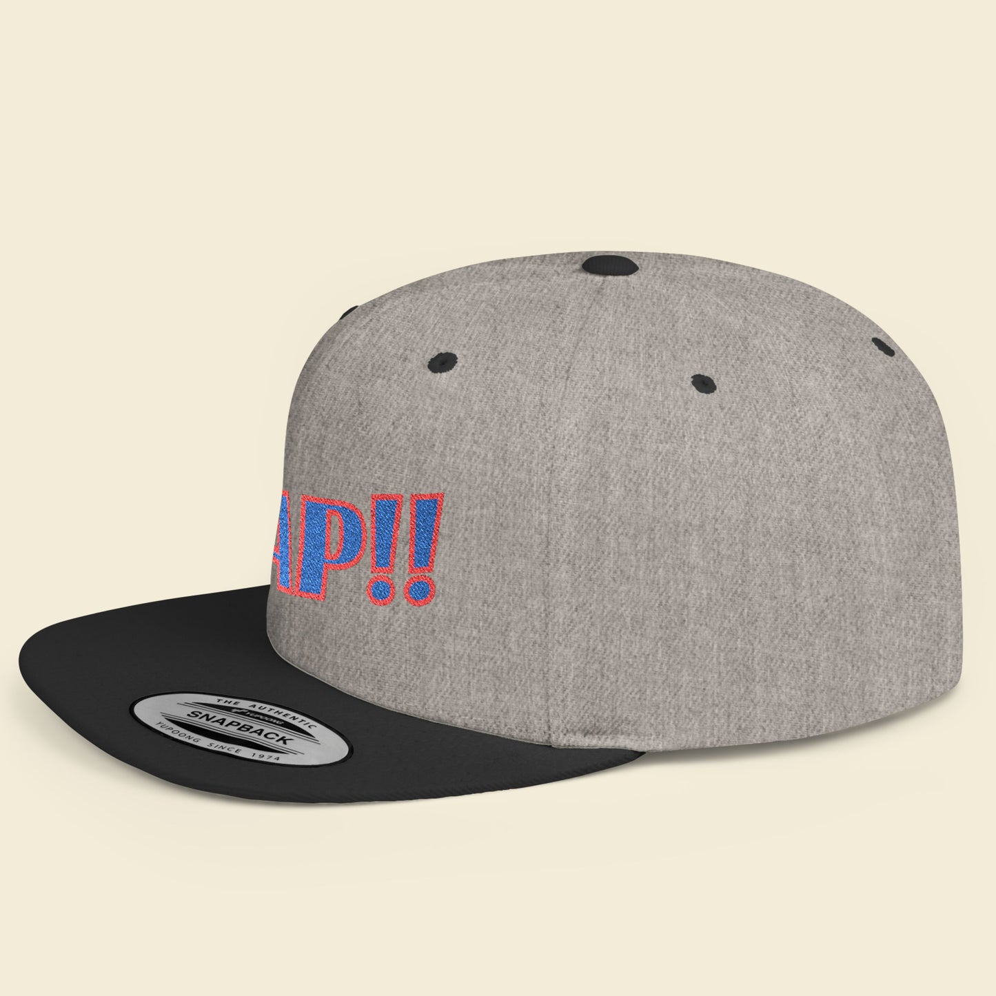 Gray cap with black brim and colorful text on a beige background.