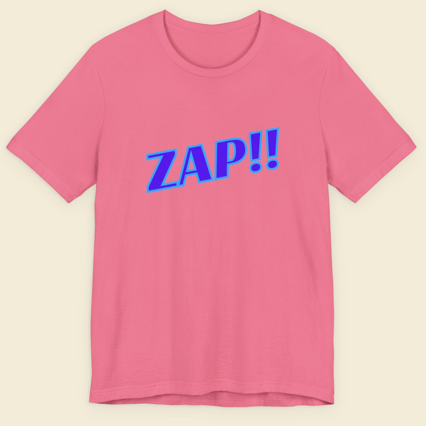 Pink t-shirt with blue 'ZAP!!' text on a beige background.